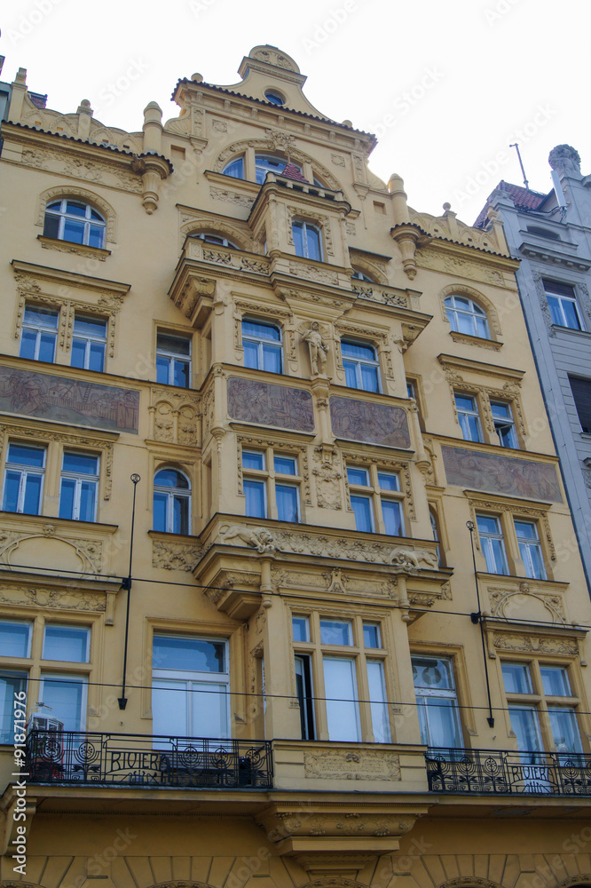 yellow facade with balcony