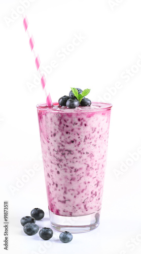 Glass of blueberry smoothie isolated on white