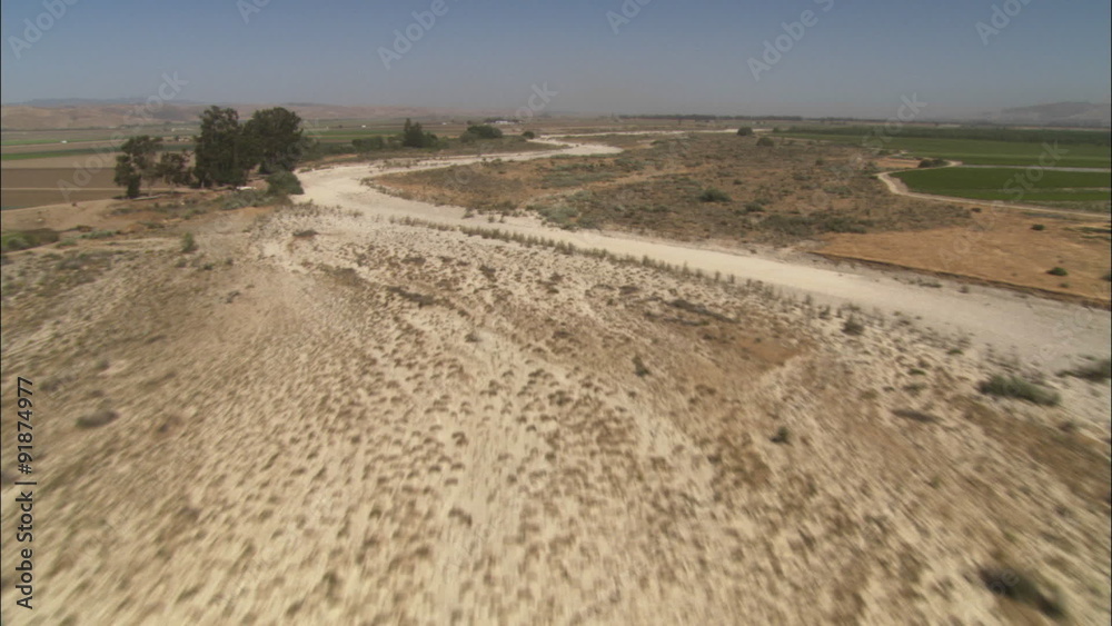 A low level helicopter aerial of the Rio Seco River in the Salinas Valley, California.