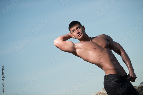 Fashion portrait of a sporty, athletic, muscular sexy man
