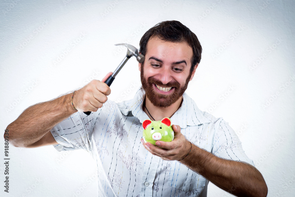 Handsome casual man with piggy bank Handsome casual man with piggy bank
