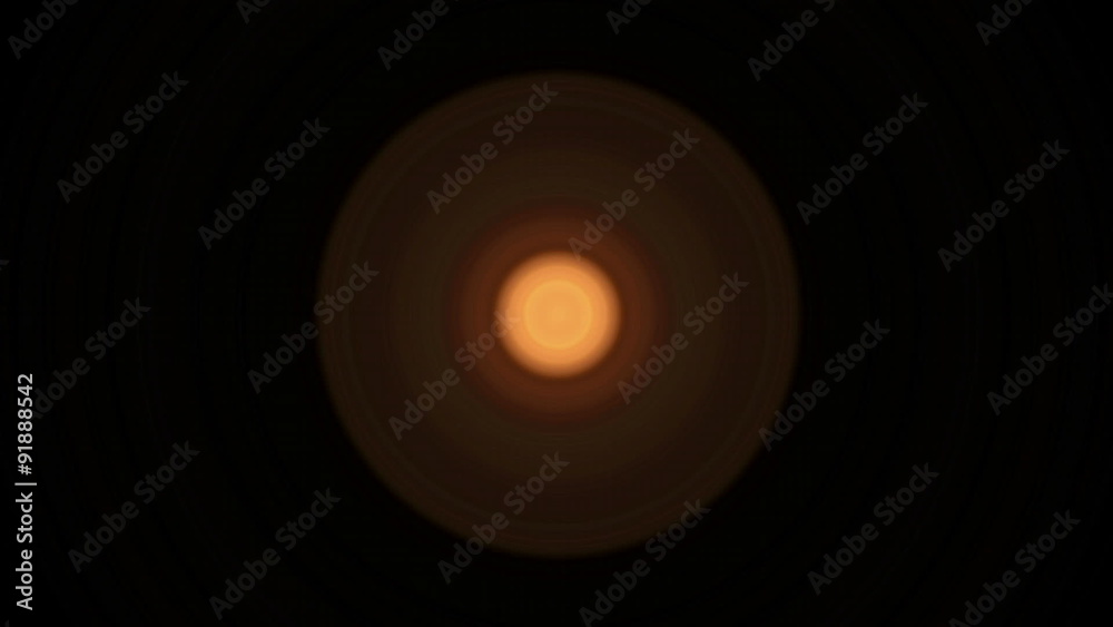 Bright orange circles flash and recede against a black background. Bright orange circles flash and recede against a black background.