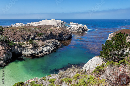 China Cove / Beach in Point Lobos State Natural Reserve, with emerald green waters & rock formations along the rugged Big Sur coastline, near Carmel and Monterey, CA. on the California Central Coast.