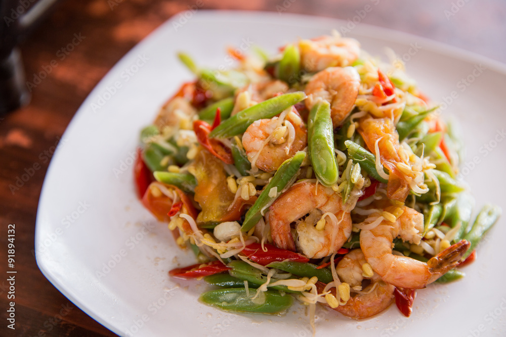 Stir-fry prawn with bean on square white plate