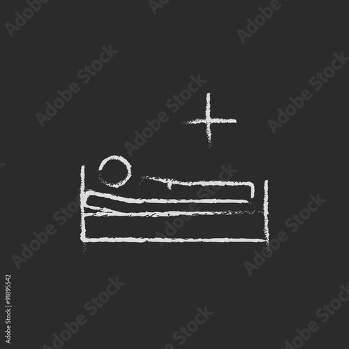 Patient lying on the bed icon drawn in chalk.