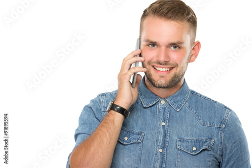 Young man talking on the phone, isolated