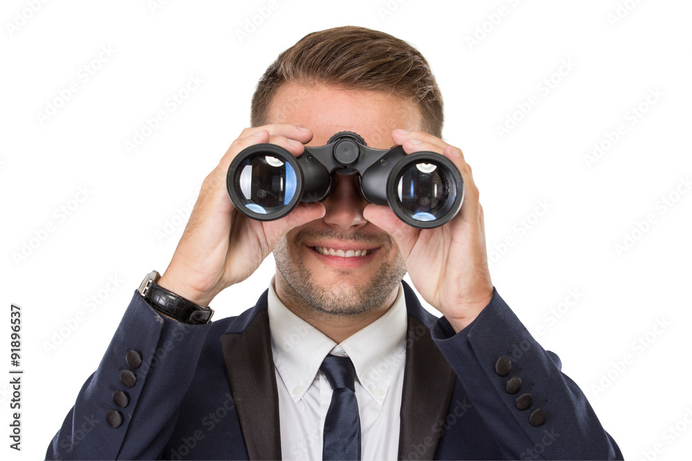 Businessman smiling while using a binocular Businessman smiling while using a binocular