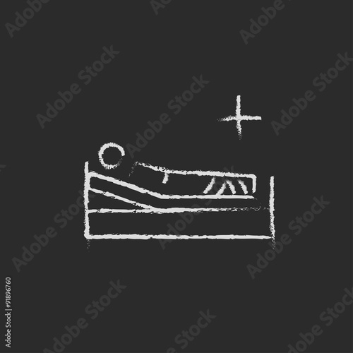 Patient lying on the bed icon drawn in chalk.