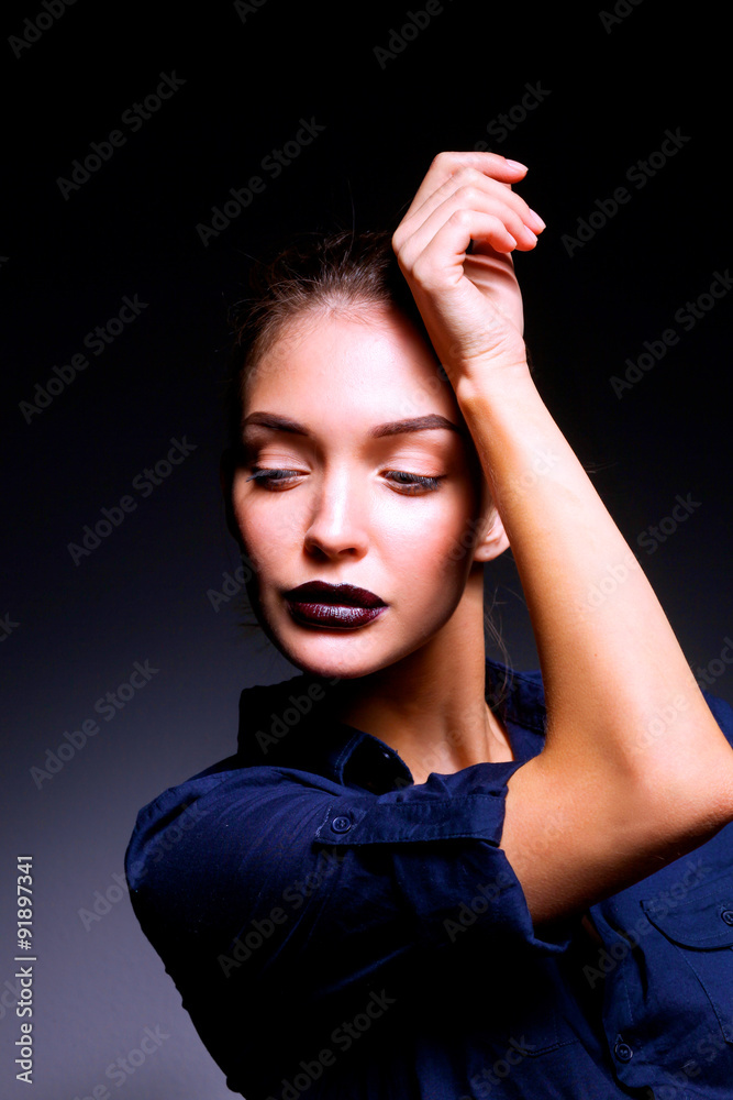 Portrait of beautiful young woman face. Isolated on black Portrait of beautiful young woman face. Isolated on black