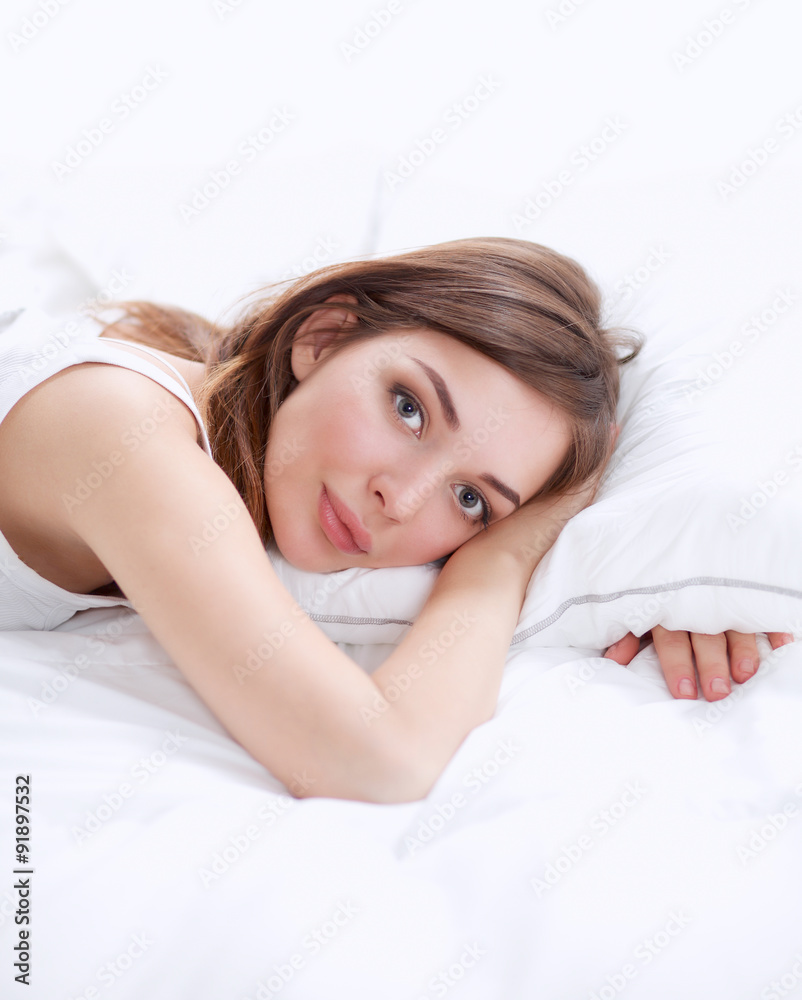 Beautiful girl lying in bedroom at early morning Beautiful girl lying in bedroom at early morning