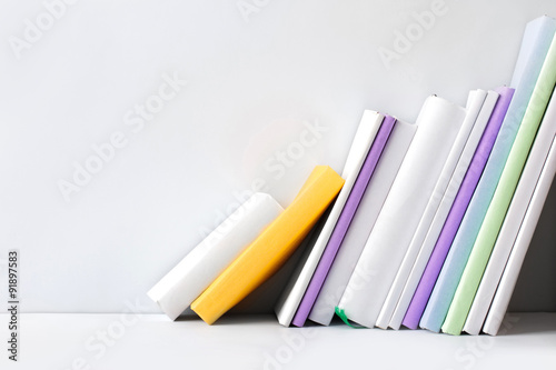 row of books on white background