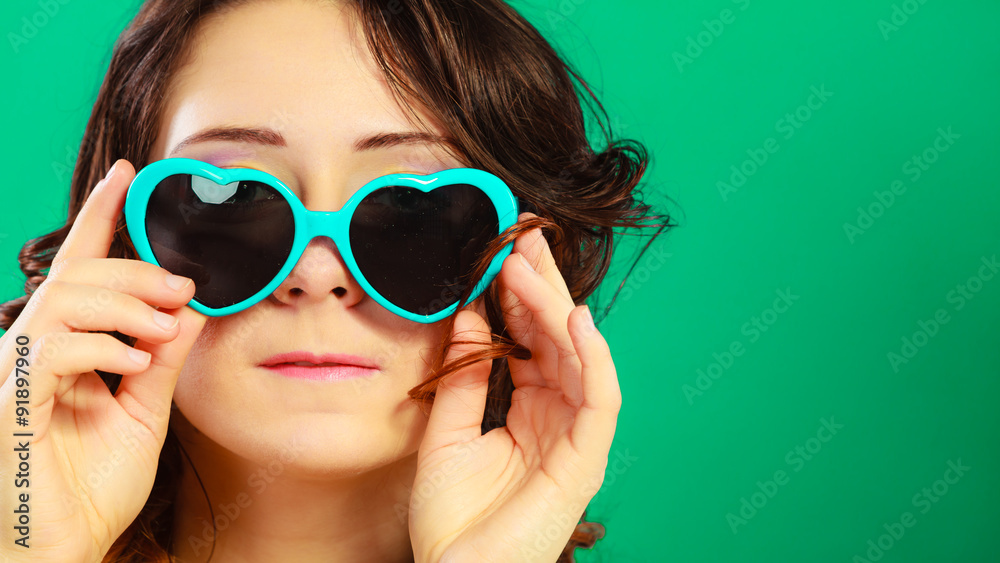 Girl in green sunglasses portrait