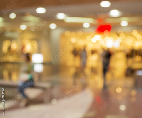 Blurred Background: people go for Shopping Mall along the window © colnihko
