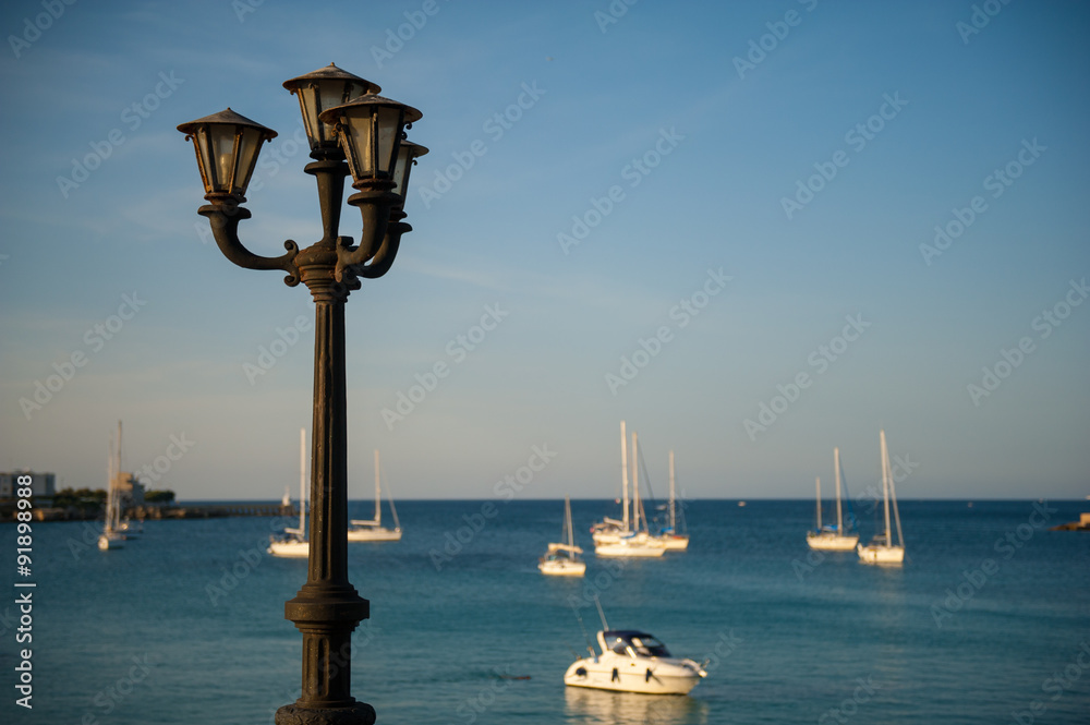 Old lamp in quiet harbor