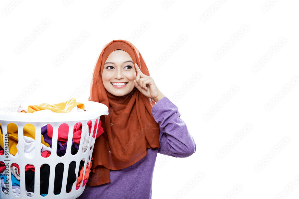 beautiful woman wearing hijab carrying laundry basket with hand beautiful woman wearing hijab carrying laundry basket with hand