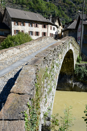 Roman bridge at Giornico on Leventina valley photo