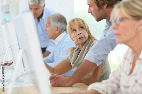 Group of senior people attending computing class