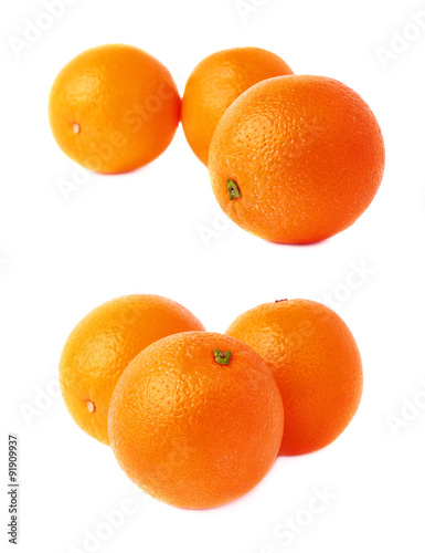 Pile of multiple ripe oranges, isolated over the white