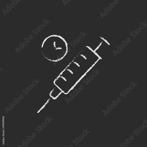 Syringe icon drawn in chalk.