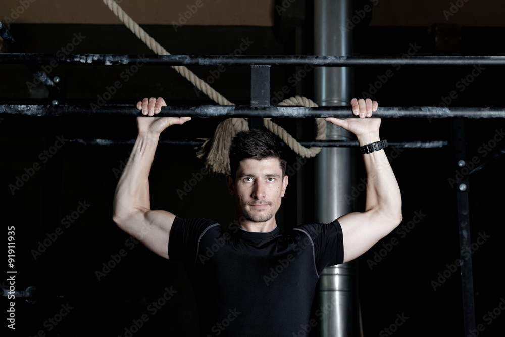 Athlete Fitness trainer working out / weight lifting in a gym Athlete Fitness trainer working out / weight lifting in a gym