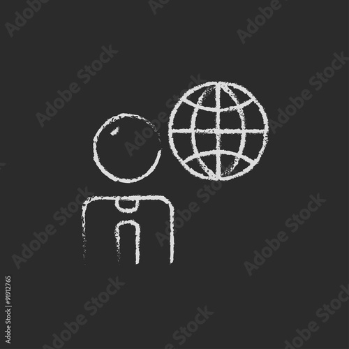 Businessman with globe icon drawn in chalk.