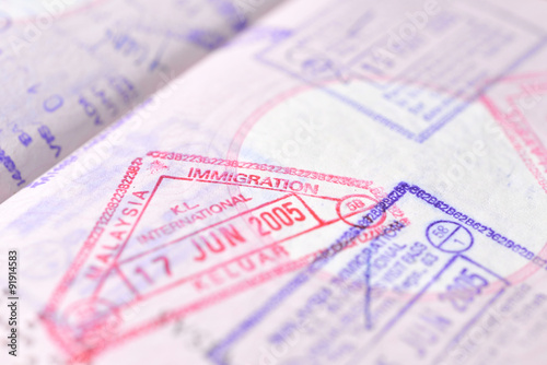 Passport stamp background - Departed Kuala Lumpur, Malaysia (selective focus)