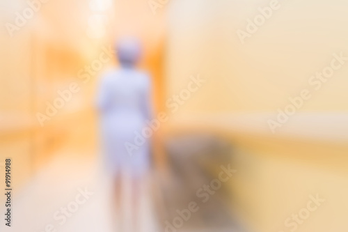 blur image of nurse in hospital walkway