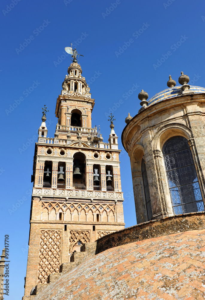 Giralda tower and lantern of Sagrario chapel, Cathedral of Seville, Andalusia, Spain Giralda tower and lantern of Sagrario chapel, Cathedral of Seville, Andalusia, Spain