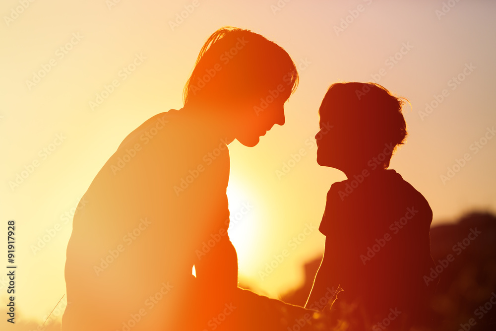 father and little son at sunset, family concept