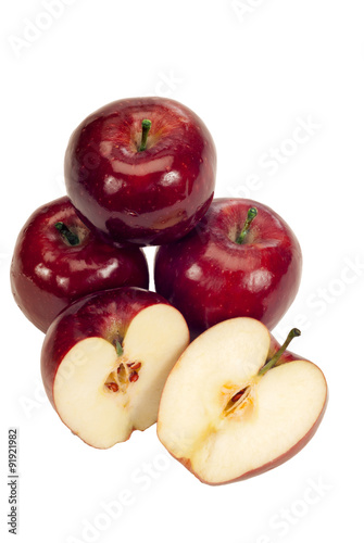 Healthy Red Delicious Apples/ Healthy red apples whole and sliced open showing seeds. Isolated on white.