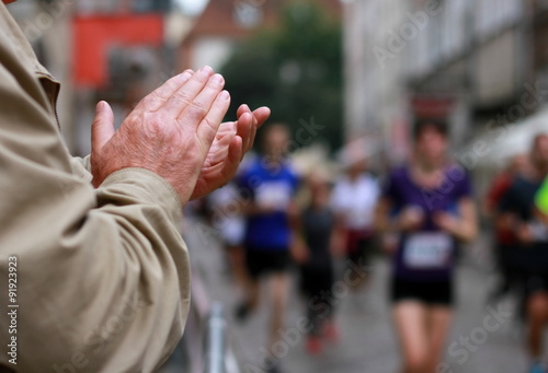 Hands applaud at a sporting event Athletics