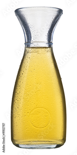 A jug filled with white wine isolated on a white background