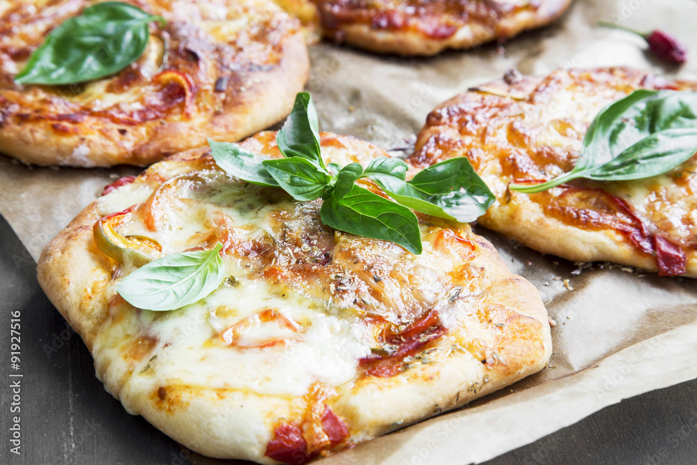 Mini Pizzas with Mozzarella, Cheese, Tomato Sauce and Fresh Basi Mini Pizzas with Mozzarella, Cheese, Tomato Sauce and Fresh Basi