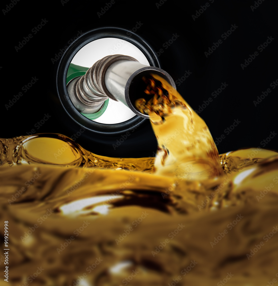 Refilling fuel view from inside of gas tank of a car StockFoto Adobe