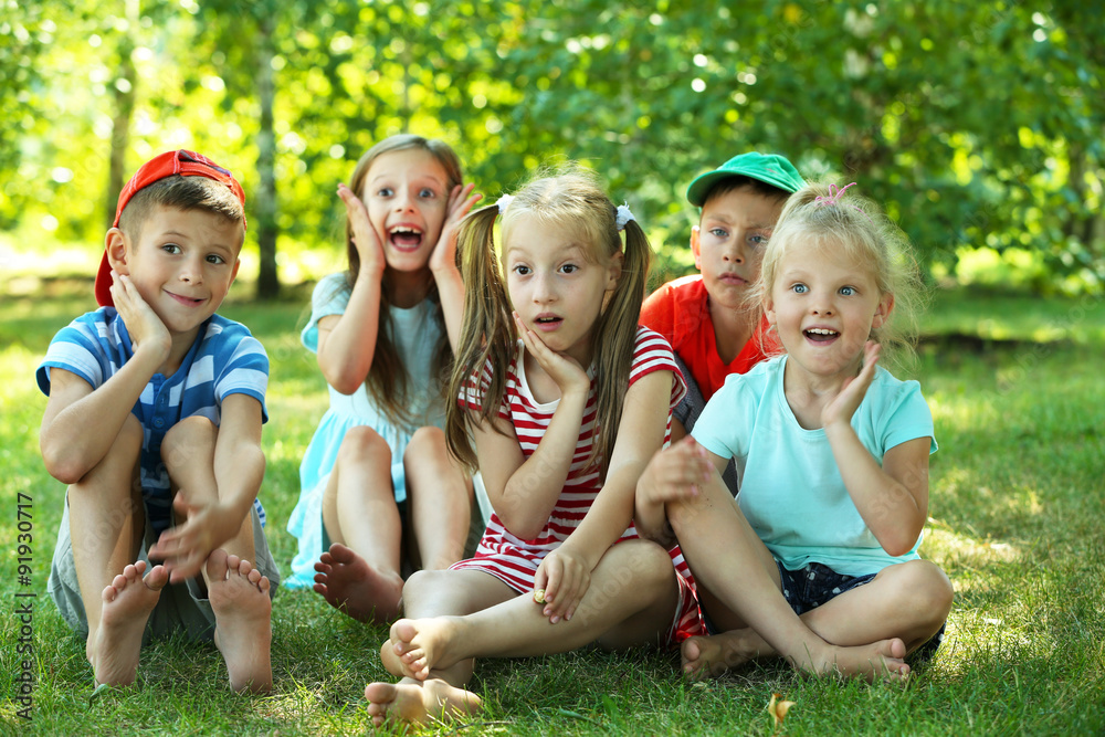 Fototapeta premium Happy active children on green grass in park