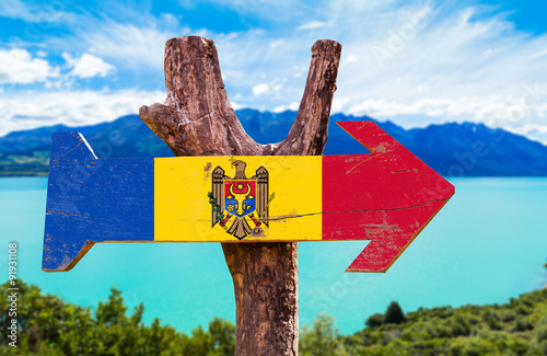 Moldova Flag wooden sign with lake background photo