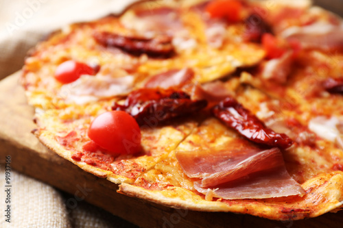 Pizza on cutting board closeup