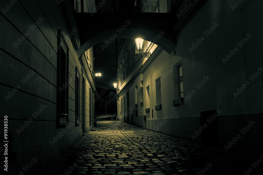 mysterious alley with lanterns in Prague at night
