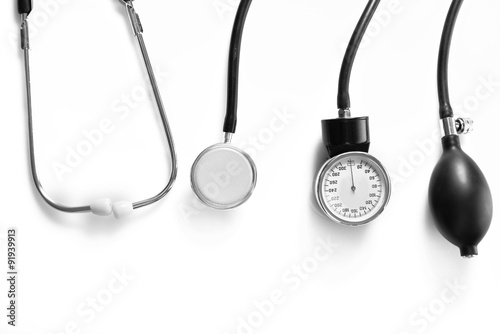 Blood pressure meter and stethoscope, on white background