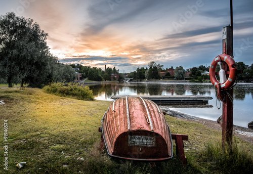 Obraz na płótnie Lifeboat, sunset river lanscape in Helsinki w salonie