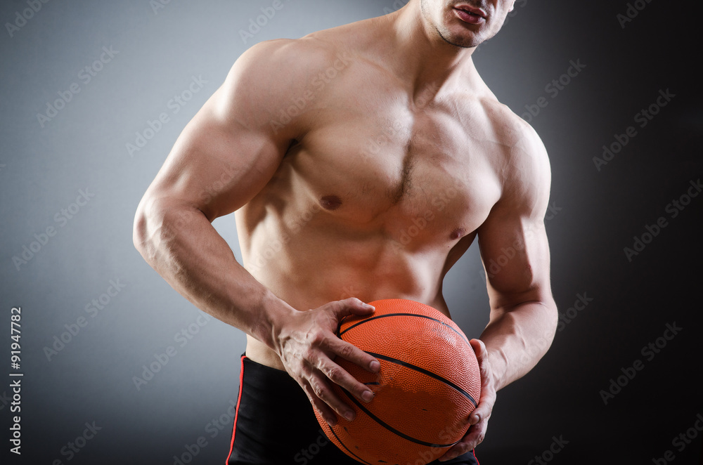 Muscular basketball in sports concept Muscular basketball in sports concept