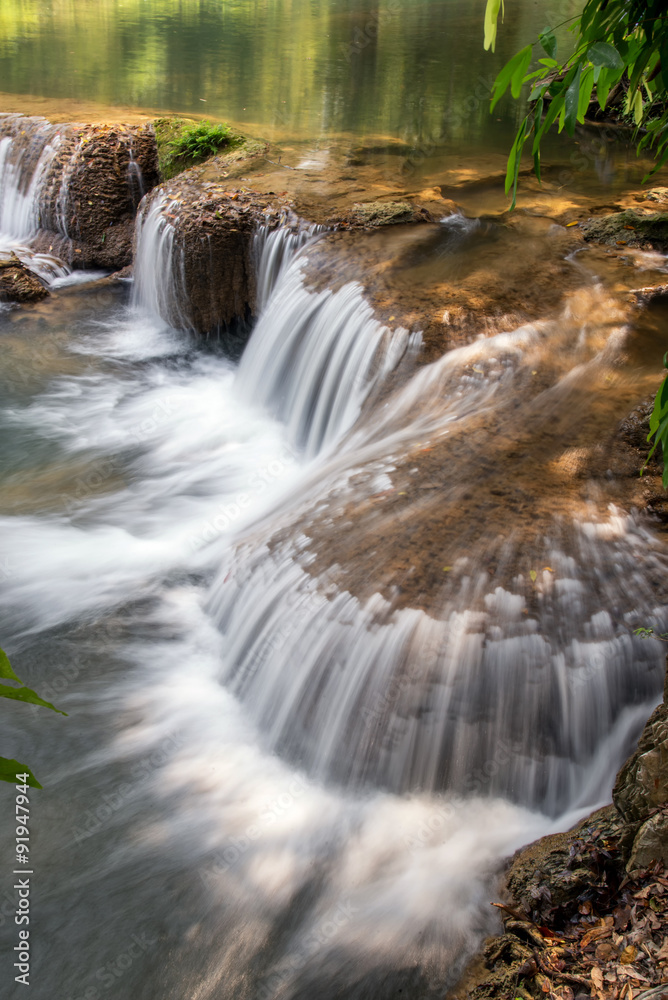 Fototapeta premium Beautiful flowing waterfall on the rock