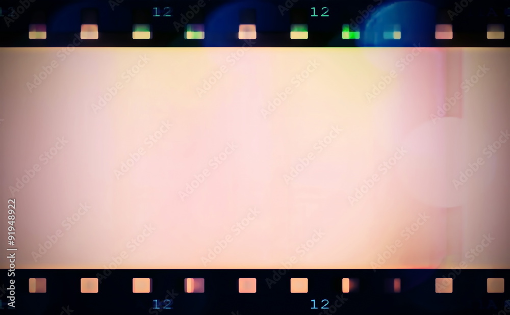 retro color film strip with spotlight background and texture