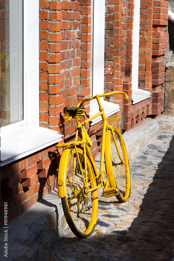 yellow bicycle on the street