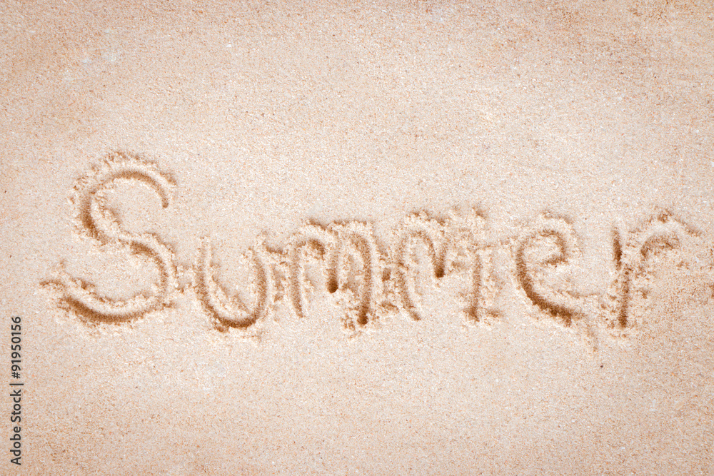 Fototapeta premium Summer text write on sand at the beach, Summer concept.