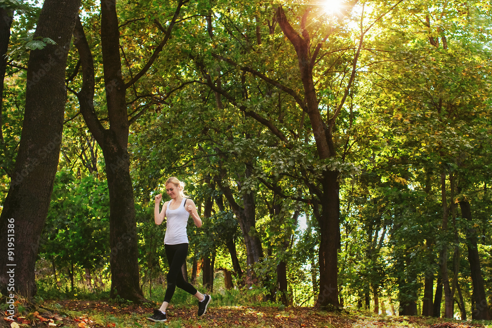 woman likes to run in the autumn park woman likes to run in the autumn park