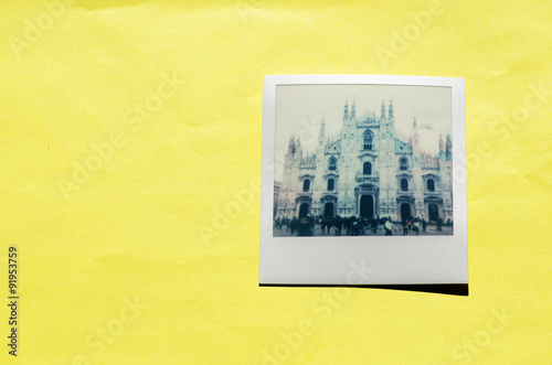 Instant photo on colored background. Polaroid Milan