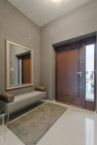 Contemporary hallway with decorative walls