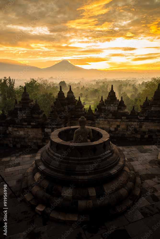 golden sky sunrise over Borobudur stupa, Indonesia