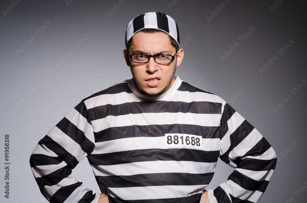Young prisoner against gray Young prisoner against gray